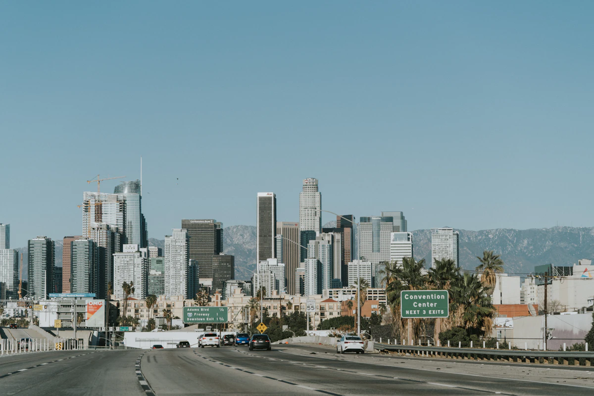 Downtown skyline beyond a busy road
