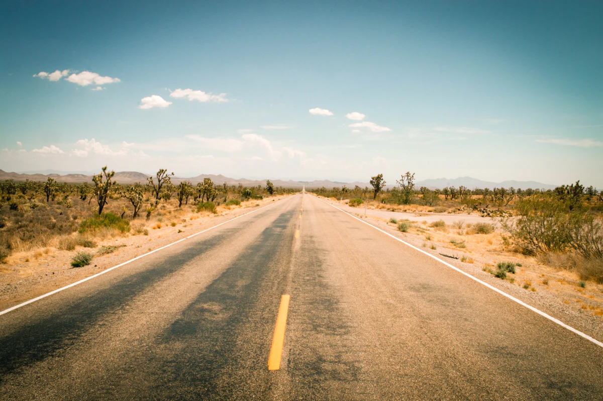 Empty two-lane road through the desert