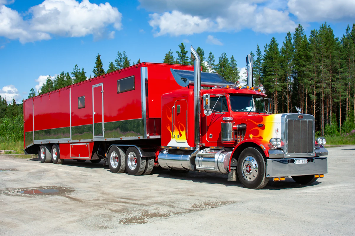 Semi truck on a tree-lined highway