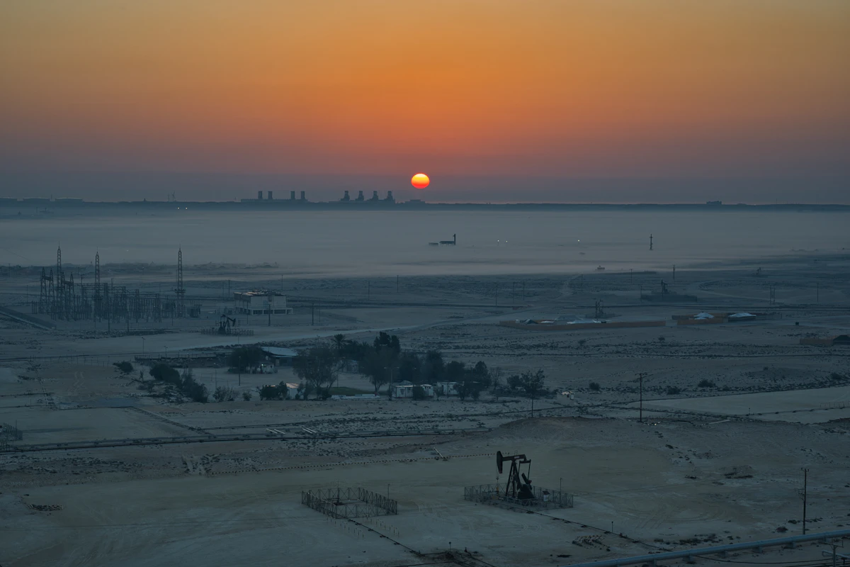 Sunrise over a flat industrial landscape