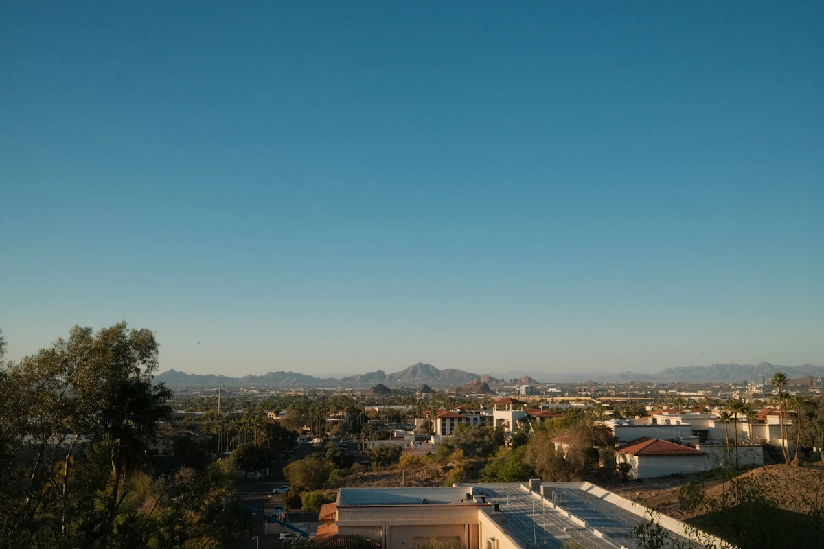 City spread below mountains under a clear sky